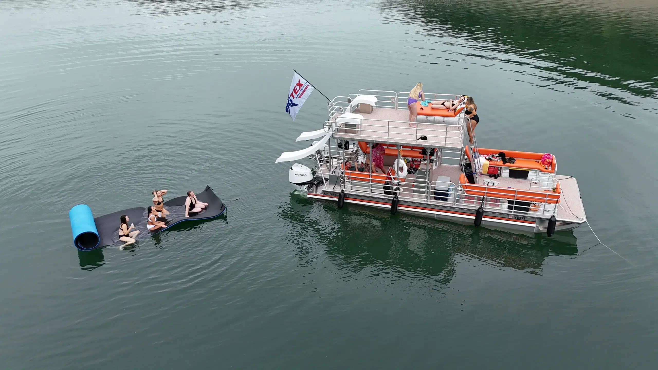 Group enjoying a boat ride on Austin's Lake